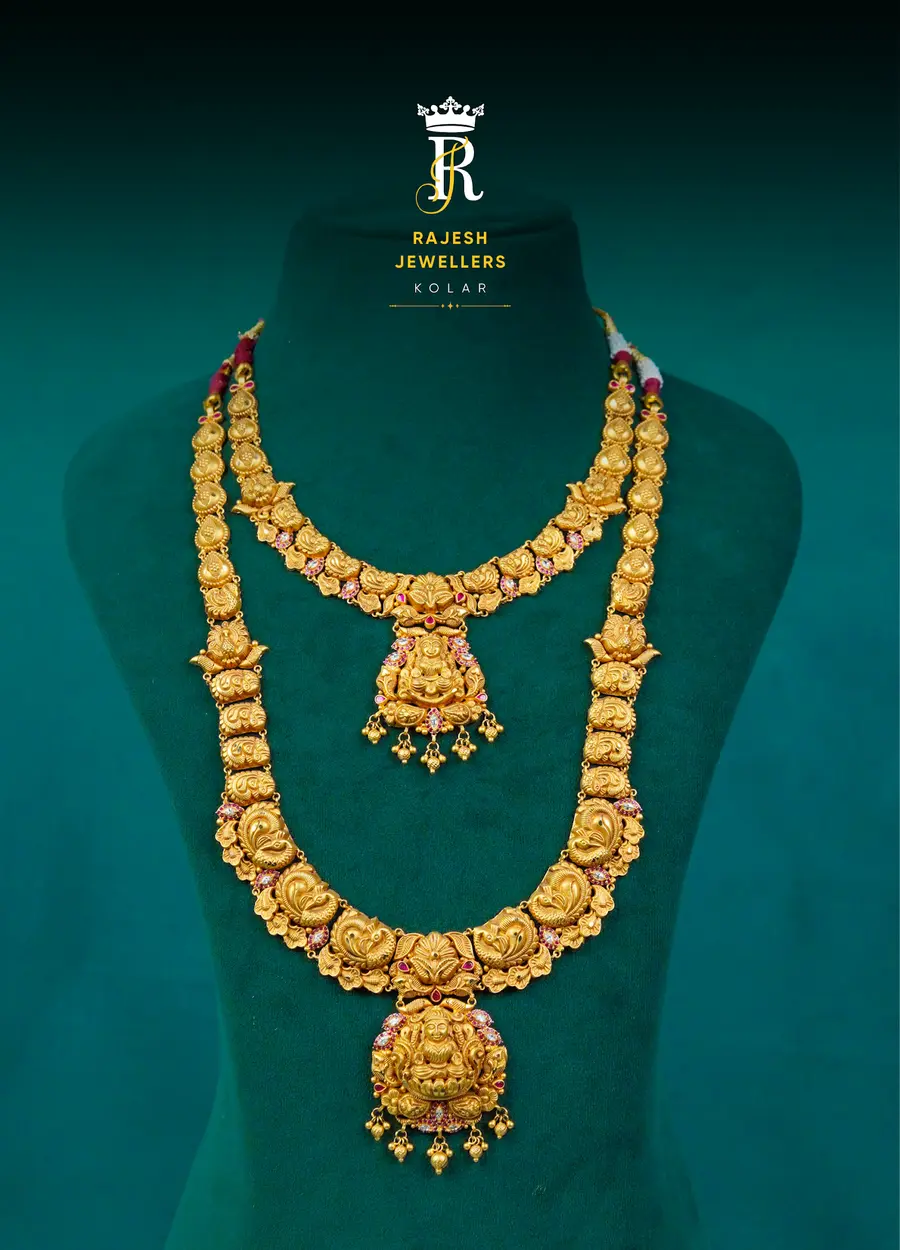 A two-piece bridal set: a short necklace above a long haram with red stone accents.